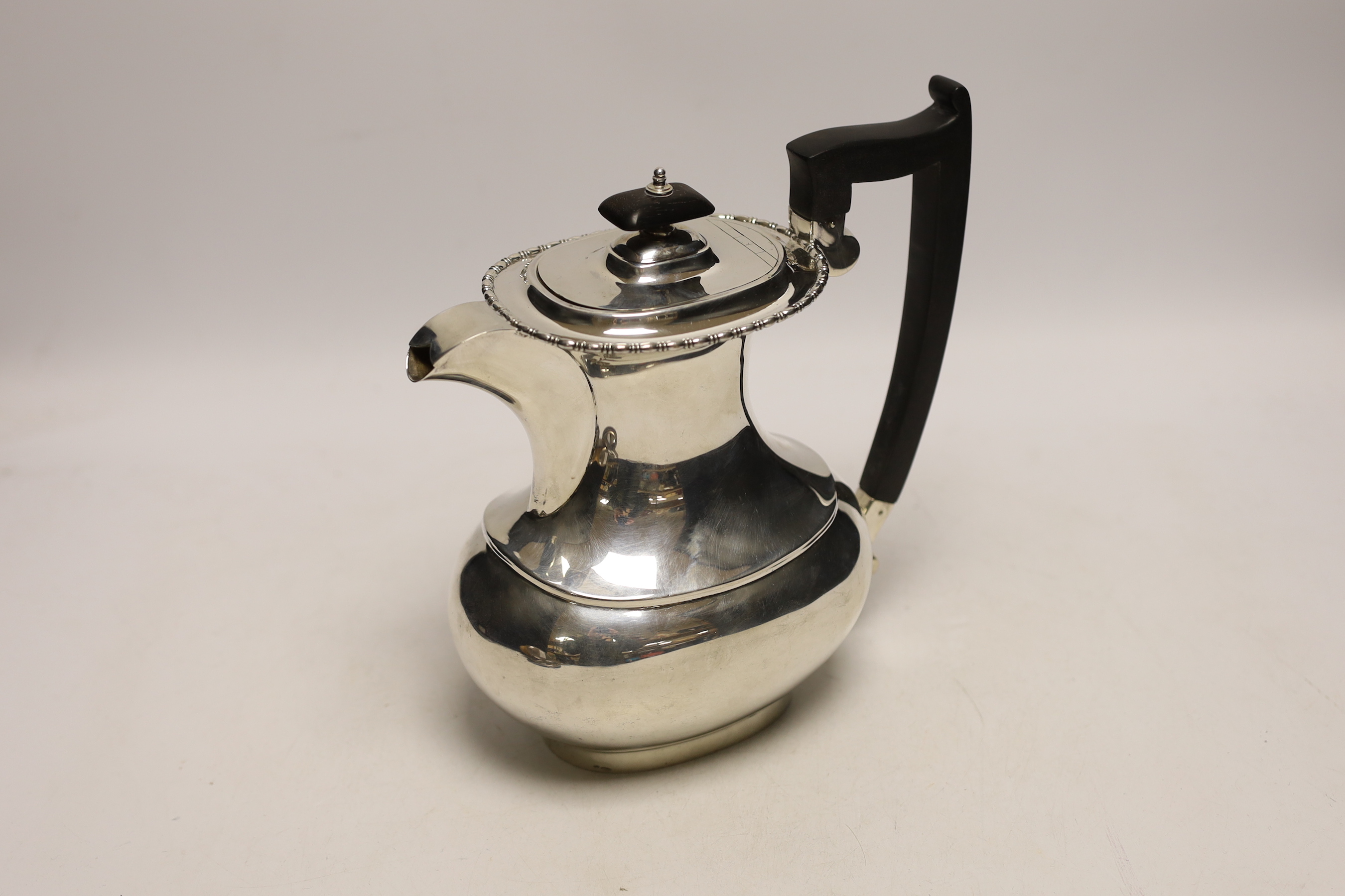 A George V silver hot water pot, Viners Ltd, Sheffield, 1936, gross weight 24.2oz.